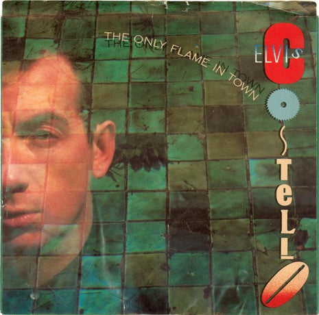 Elvis Costello : The Only Flame In Town (7", Single, Mono, Styrene, 3:5)