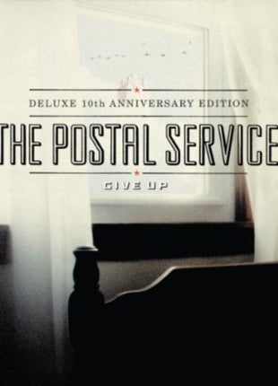 the album cover for The Postal Service - Give Up