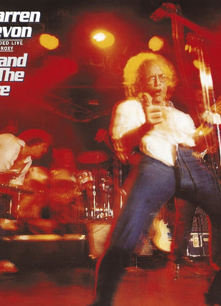 the album cover for Warren Zevon - Stand In The Fire: Recorded Live At The Roxy [LP]