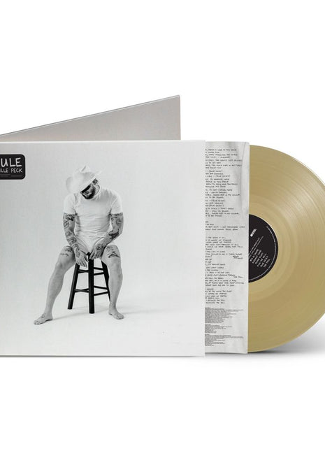 the album cover for Orville Peck - Mule [Indie Exclusive Tan Translucent]