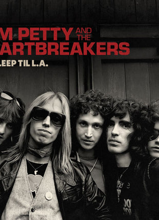 the album cover for Tom Petty And The Heartbreakers - No Sleep Til L.A. [Indie Exclusive Galaxy Ruby Translucent Black Opaque 180g]