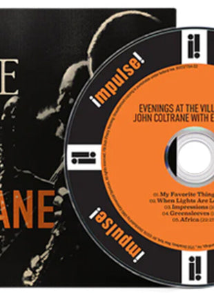 the album cover for John Coltrane - Evenings At The Village Gate: John Coltrane With Eric Dolphy
