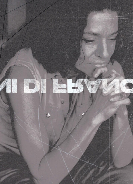 the album cover for ANI DIFRANCO	 - UNPRECEDENTED SH!T [INDIE EXCLUSIVE COKE BOTTLE CLEAR LP]	