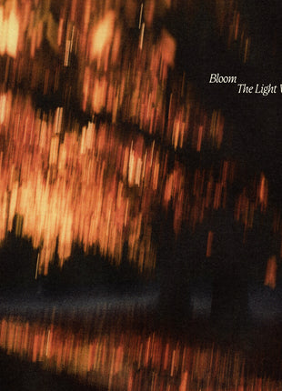 the album cover for Bloom - The Light We Chase [Indie Exclusive Black Ice/Blood Red LP]