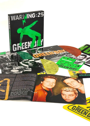 the album cover for Green Day - Warning (25th Anniversary Deluxe Edition) [Indie Exclusive Vinyl Box - Green, Yellow, and Orange LP]