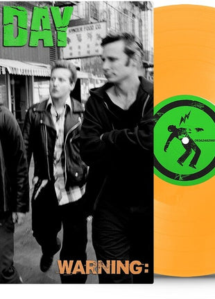 the album cover for Green Day - Warning (25th Anniversary Deluxe Edition) [Neon Orange LP]