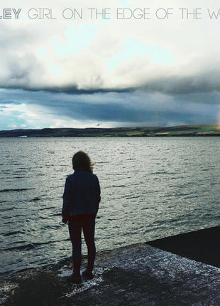 the album cover for Keeley - Girl On The Edge Of The World