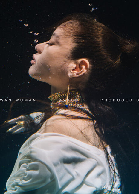 the album cover for Awich - Okinawan Wuman [Clear Vinyl]