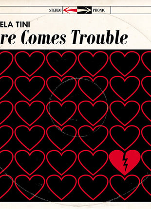 the album cover for Angela Tini - Here Comes Trouble [Deluxe] (Post)
