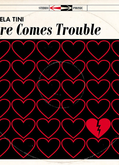 the album cover for Angela Tini - Here Comes Trouble [Deluxe] (Post)