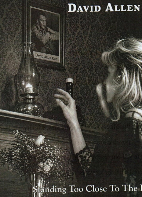 the album cover for David Allan Coe - Standing Too Close To the Flame