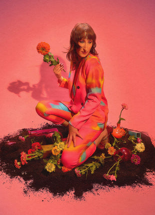 the album cover for Lia Braswell - Rising (honeymoon Suite Pearlescent Blood-red/black Swirled Vinyl/2lp)