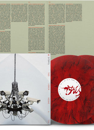 the album cover for Interpol - This Mirror Weighs a Ton [Edición Española Exclusive Rojo Perlado]
