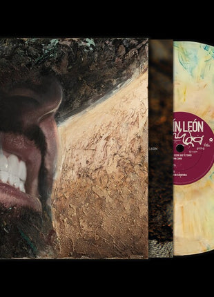 the album cover for Carin Leon - Muda [Birthday Cake 180g]