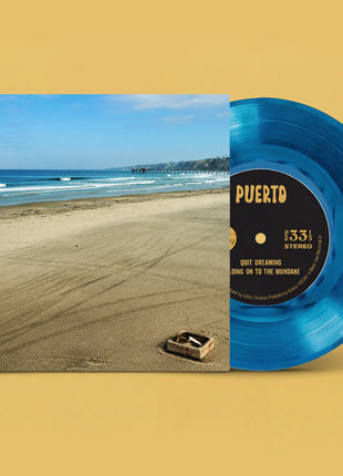 the album cover for Puerto - Quit Dreaming / Holding On To The Mundane (Blue)