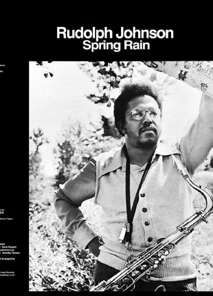 the album cover for Rudolph Johnson - Spring Rain - Remastered - Blue/Black Swirl (Blk)