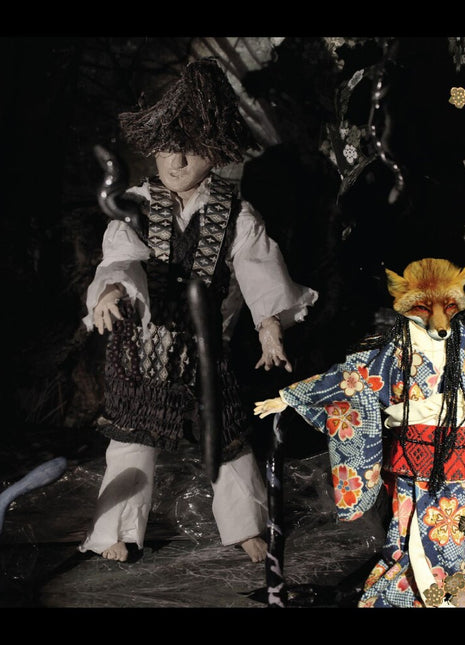 the album cover for Ikue Mori - Enchanted & Delighted