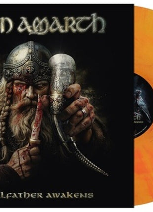 the album cover for Amon Amarth - The Allfather Awakens [Indie Exclusive Yggdrasil Burns]