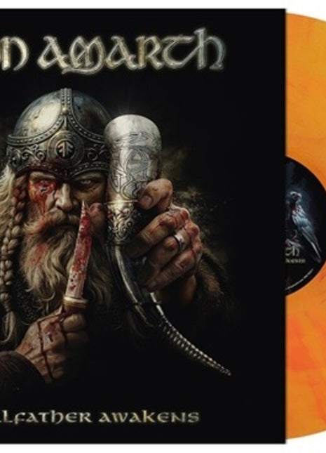 the album cover for Amon Amarth - The Allfather Awakens [Indie Exclusive Yggdrasil Burns]