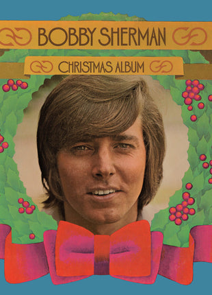 the album cover for Bobby Sherman - Bobby Sherman Christmas Album [Clear Vinyl] [Limited Edition] (Red)