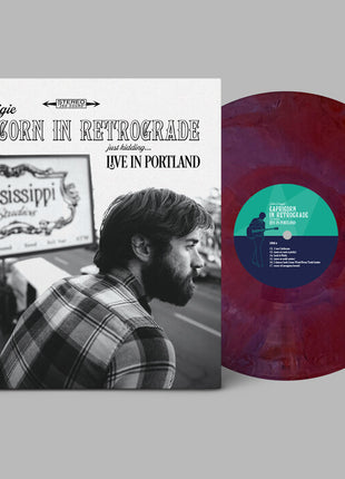 the album cover for John Craigie - Capricorn In Retrograde Just Kidding Live In [Indie Exclusive]