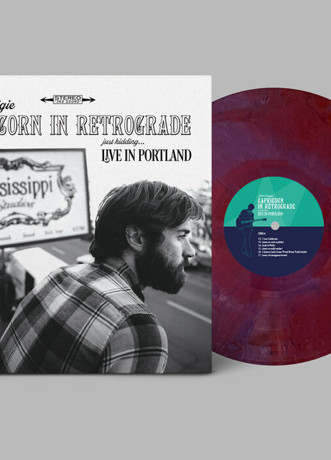 the album cover for John Craigie - Capricorn In Retrograde Just Kidding Live In [Indie Exclusive]