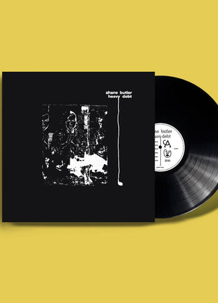 the album cover for Shane Butler - Heavy Debt